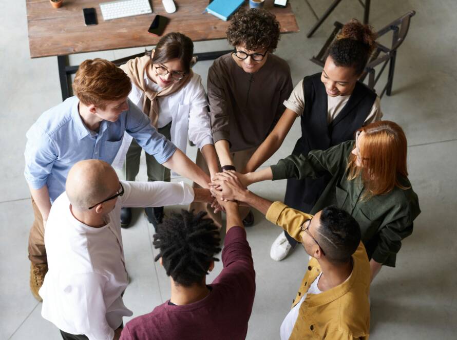 Top view of diverse group of people collaborating in office setting.